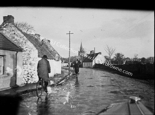 VILLAGE SCENE CYCLIST